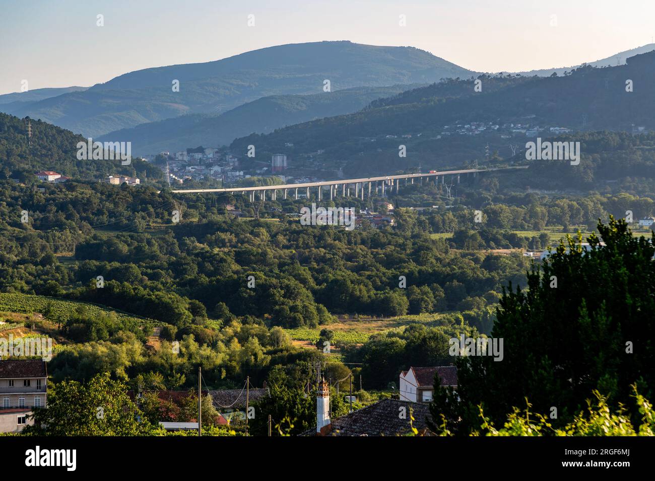 Road bridge Viaduto do río Avia, A-52 motorway road, view from Campo ...