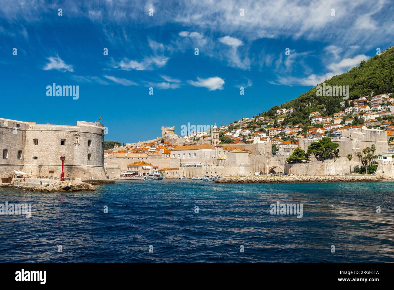 UNCESO world heritage old town of Dubrovnik with fortified walls with spectacular views from the walls over the old town, the narrow streets and the A Stock Photo