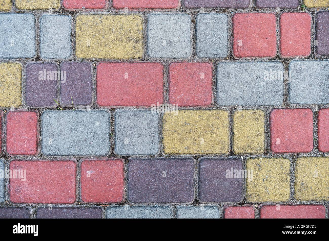 Surface of multi-colored paving slabs. Beautiful pattern, background close-up Stock Photo