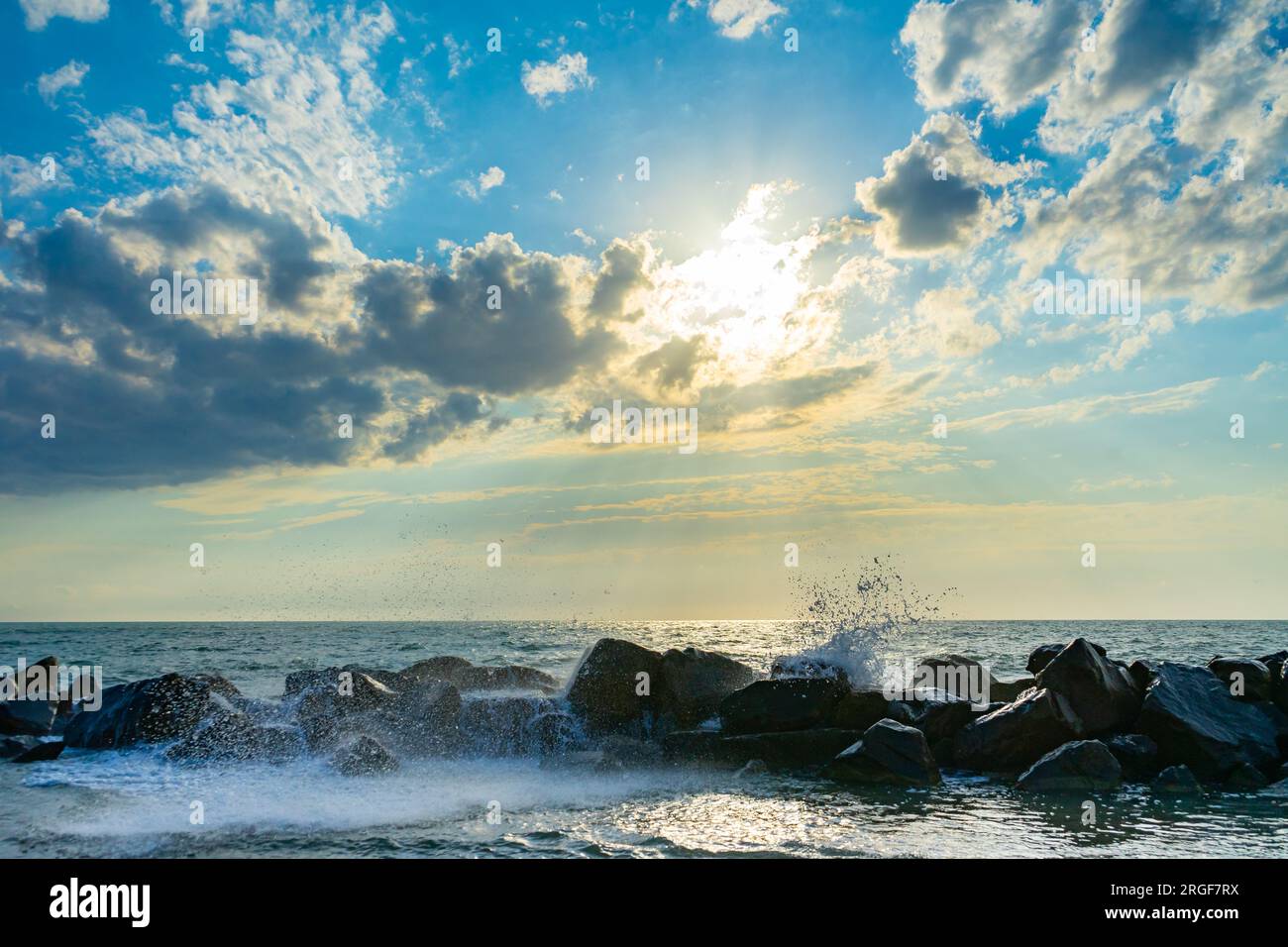 sunset over the sea with waves Stock Photo