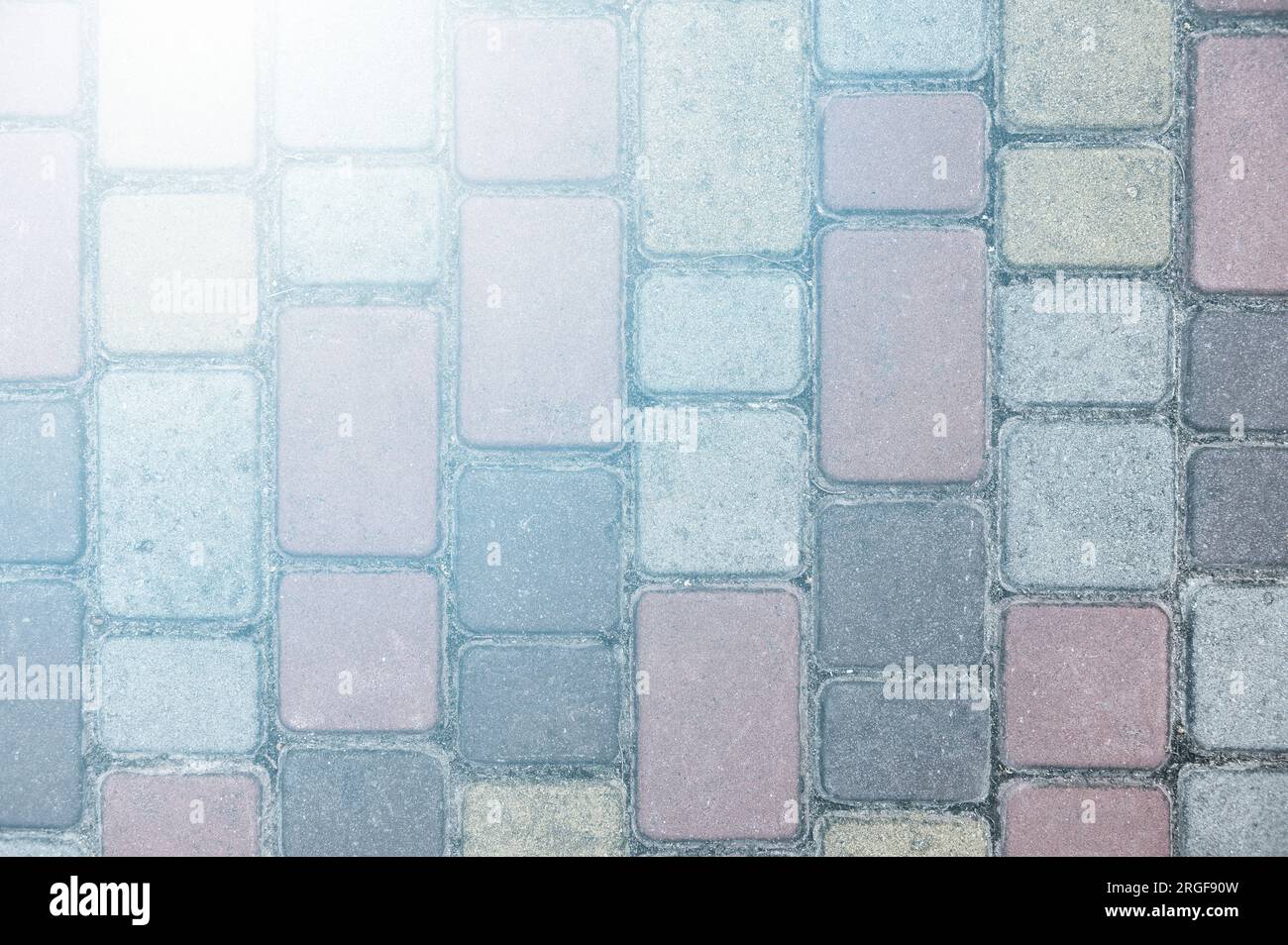 Surface of multi-colored paving slabs. Beautiful pattern, background close-up Stock Photo