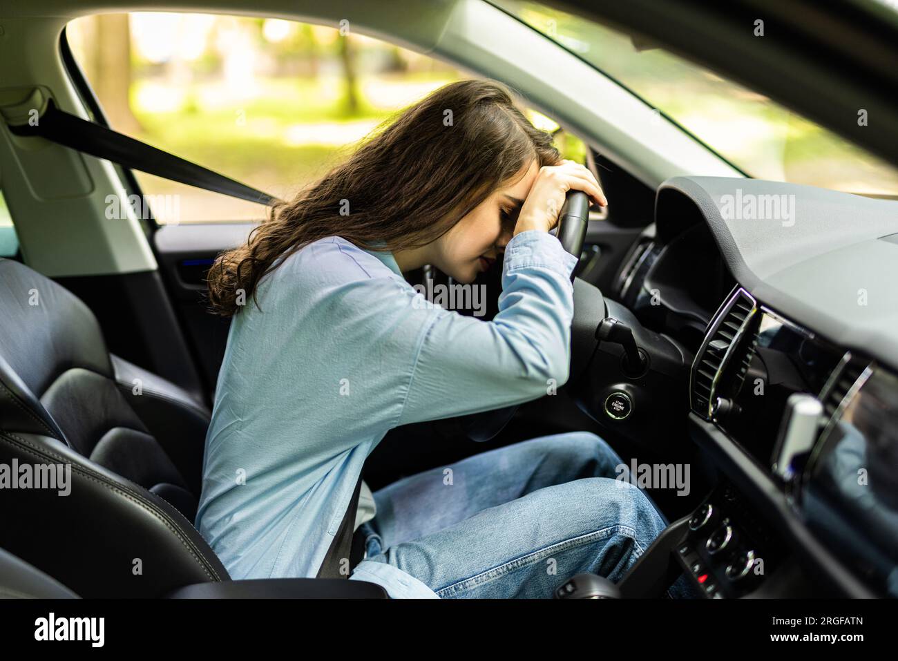 Stressed woman drive car feeling sad and angry. Driving when tired and