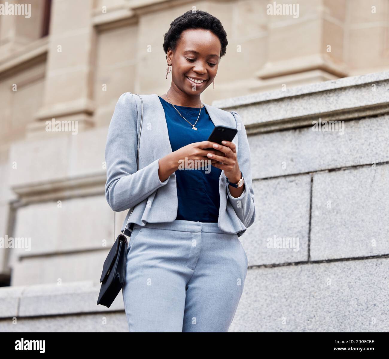 Black woman walking work typing hi-res stock photography and images - Alamy