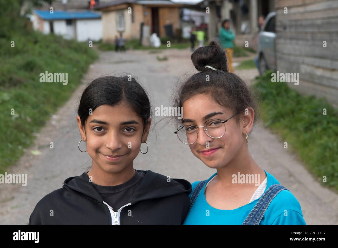 Romany gypsy girls, sisters or and friends living in the gypsy settlement on the outskirts of Sumiac, Brezno District, Slovakia August 2023. 2020s HOMER SYKES Stock Photo
