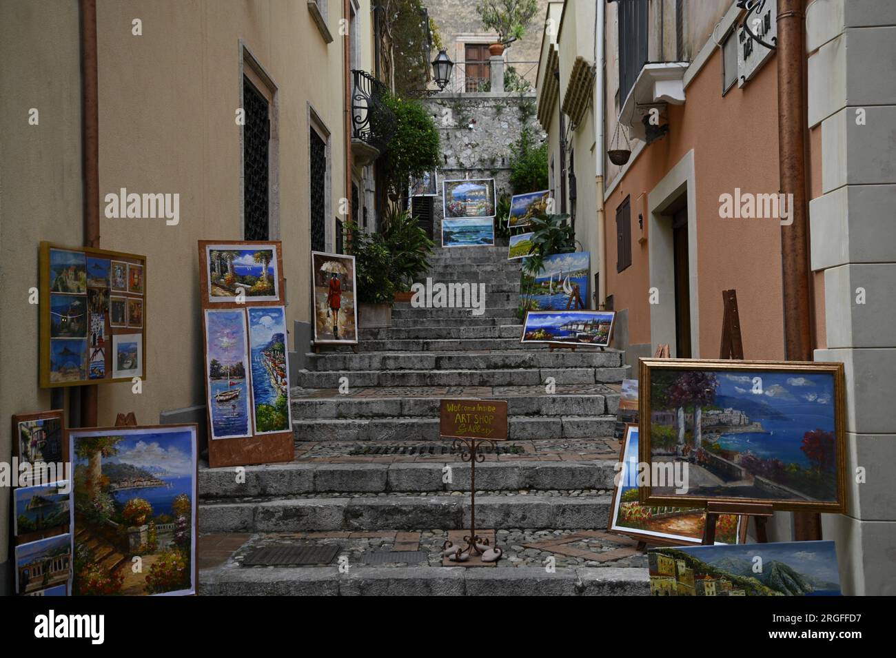 Art Shop Gallery painting display on the stone steps of Via Dei Fabi in