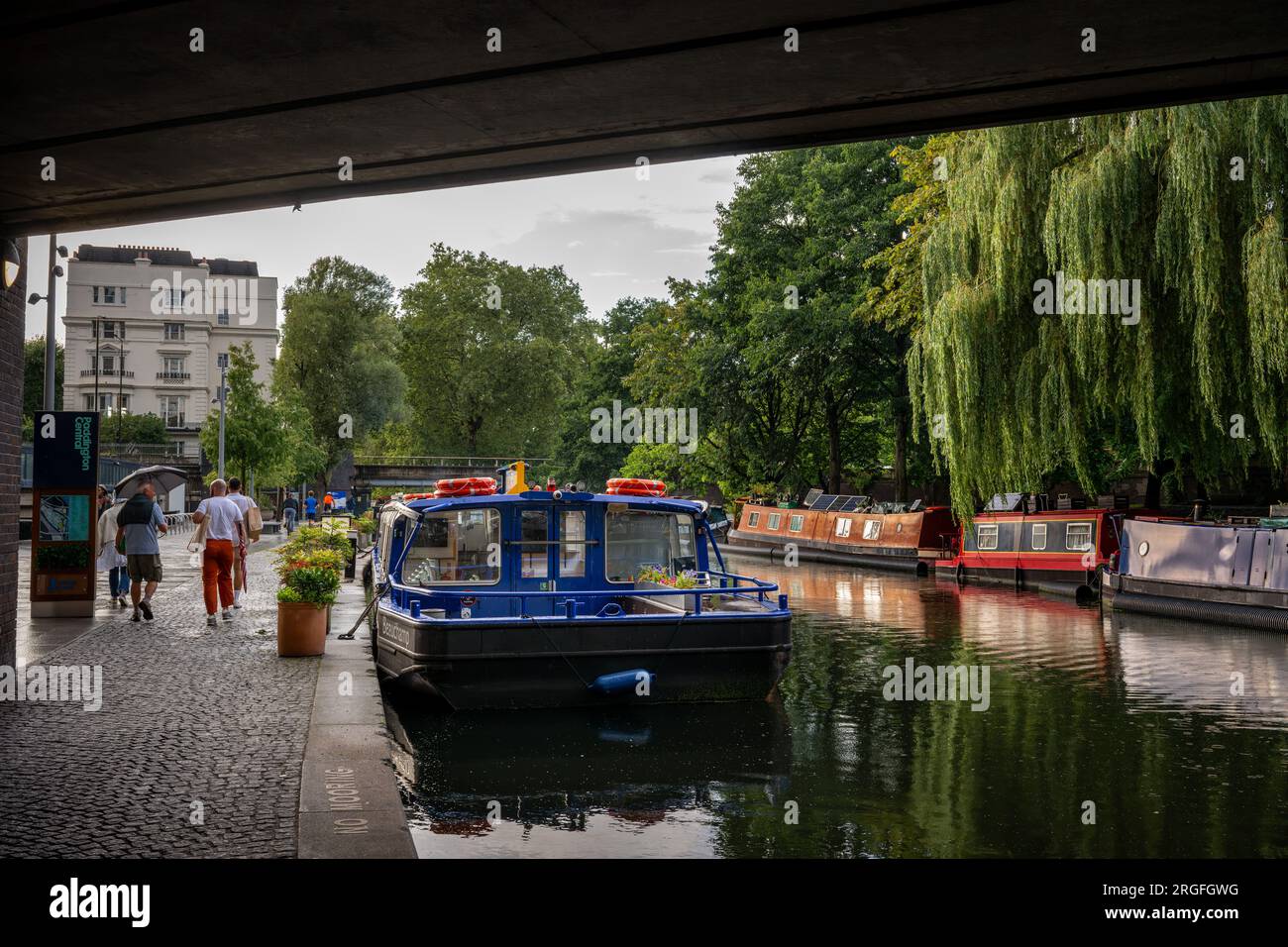 London, UK: Canal boats on the Paddington branch of the Grand Union Canal between Little Venice and Paddington Basin. Stock Photo