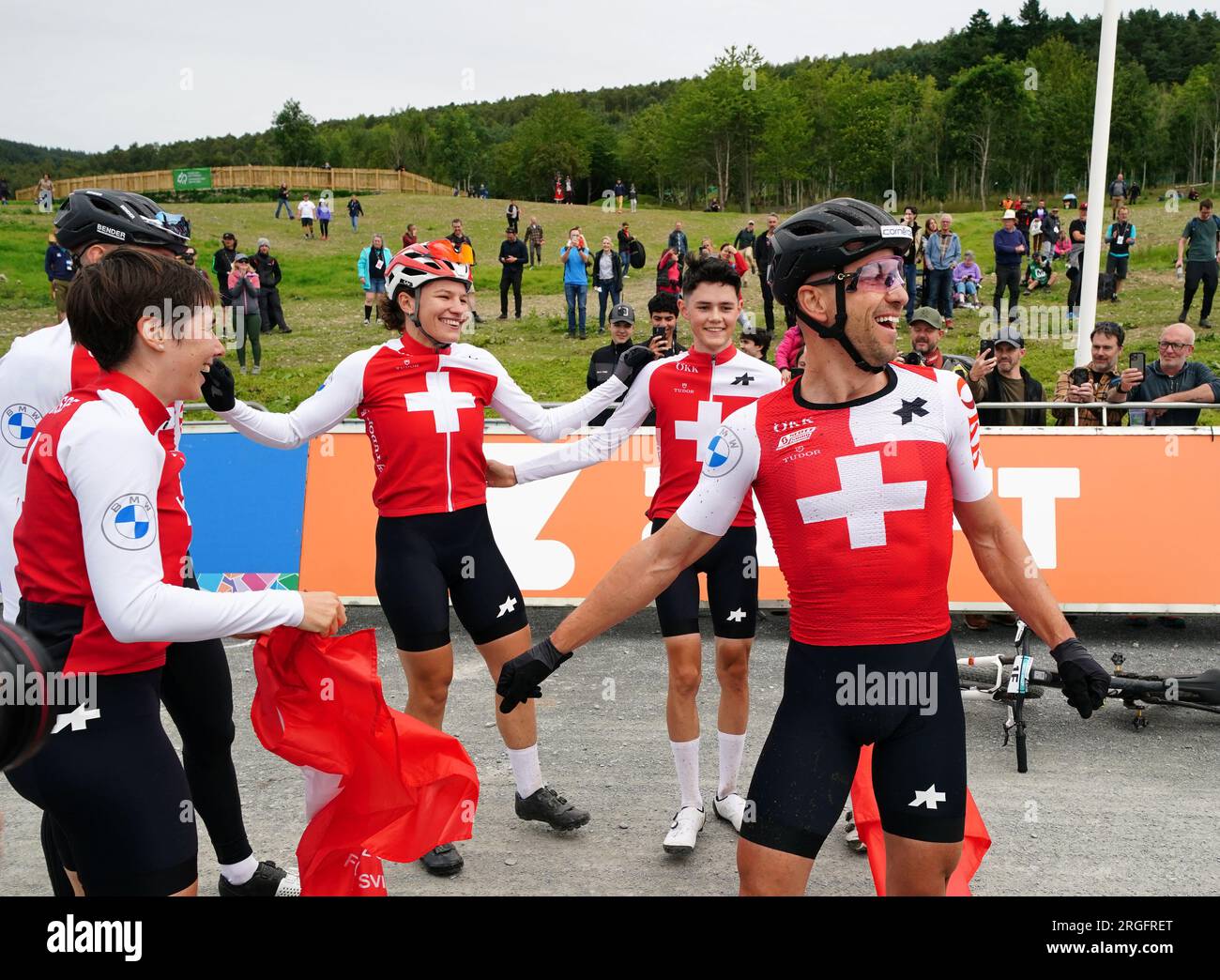 The Switzerland team celebrate victory in the Mixed Team Relay race