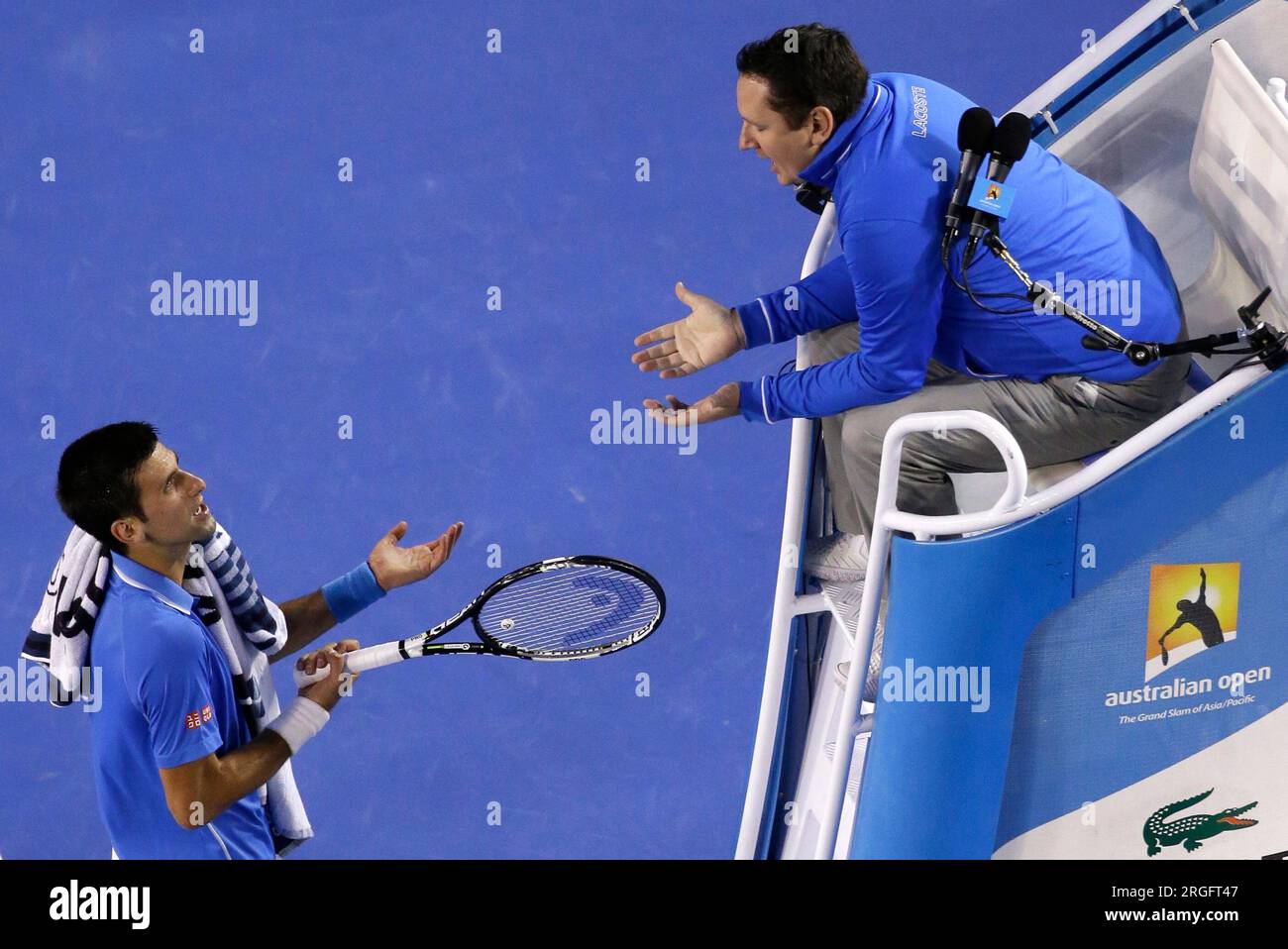 FILE - Novak Djokovic of Serbia, left, talks with chair umpire Jake Garner  of the U.S. as he plays Andy Murray of Britain during the men's singles  final at the Australian Open