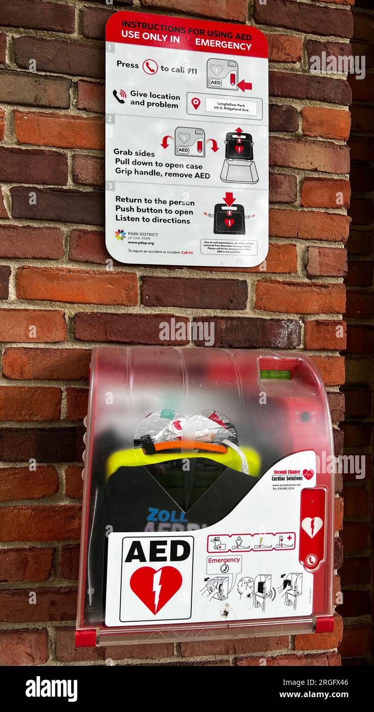 Automated External Defibrillator installed outside a bathroom at a public park facility. The AEDs are wirelessly connected directly to 911 dispatch Stock Photo