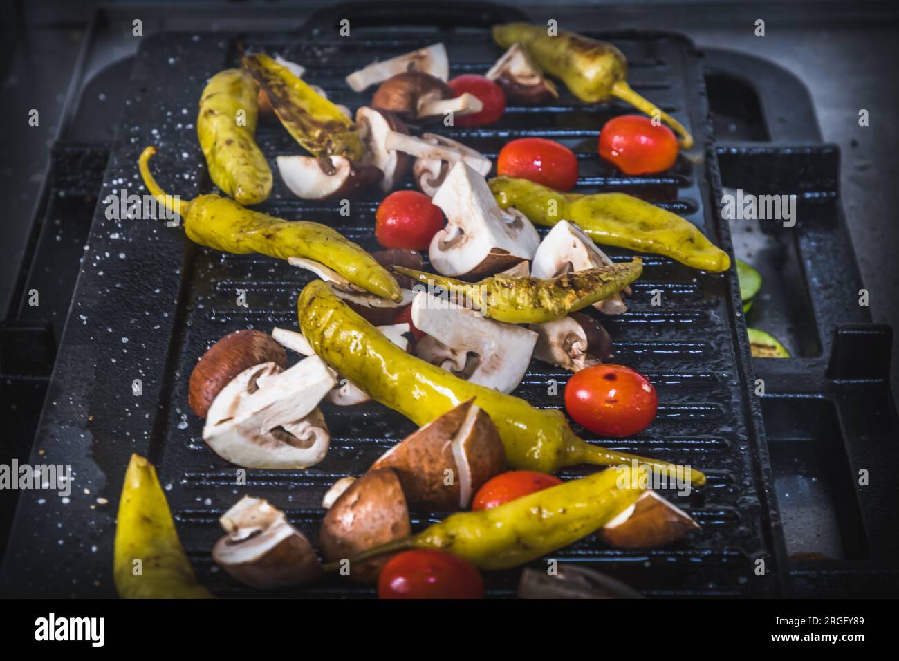 Freshly grilled vegetables in a grill pan on the grill. Italian antipasti. Stock Photo