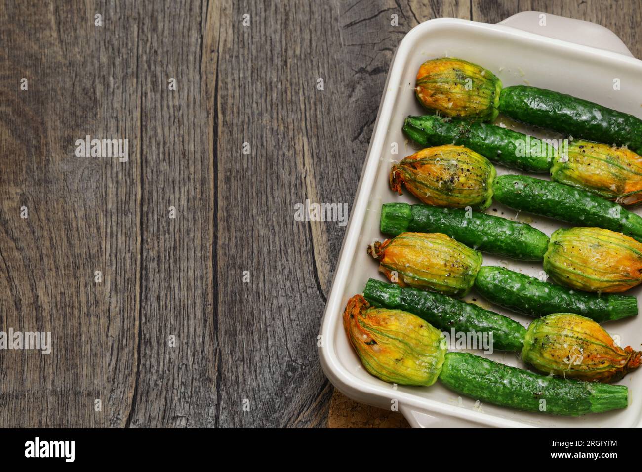 Oven baked stuffed zucchini flowers, Italian cuisine Stock Photo