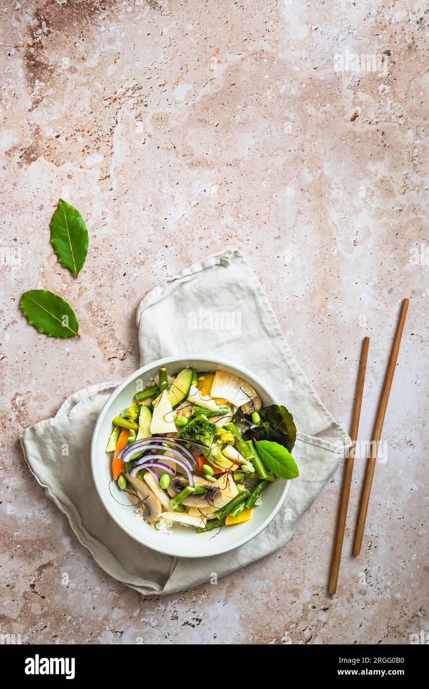 Bowl with Asian vegetables, vegan curry, healthy food. Top view with copy space. Stock Photo