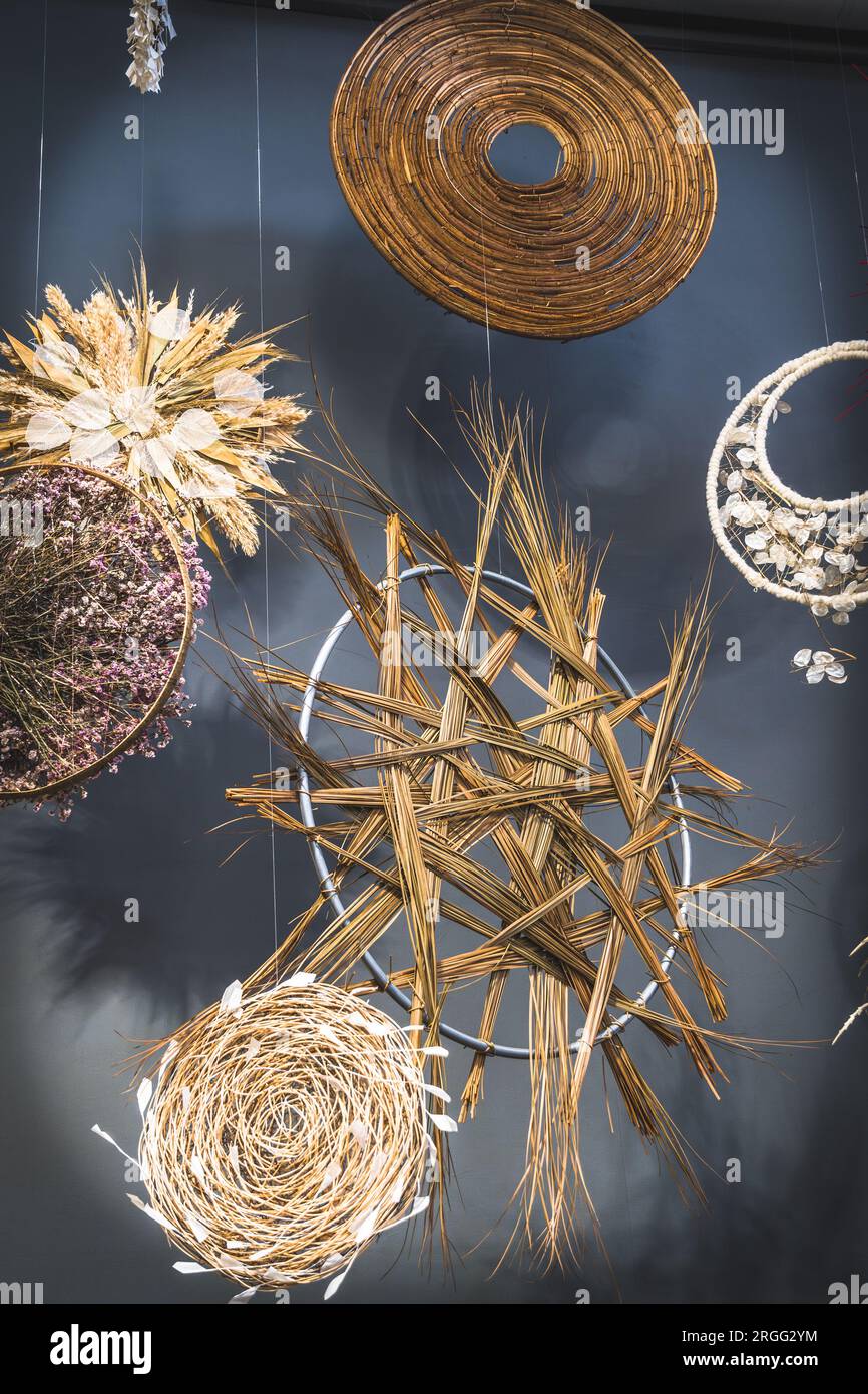 Various round decorative objects made from natural materials hanging