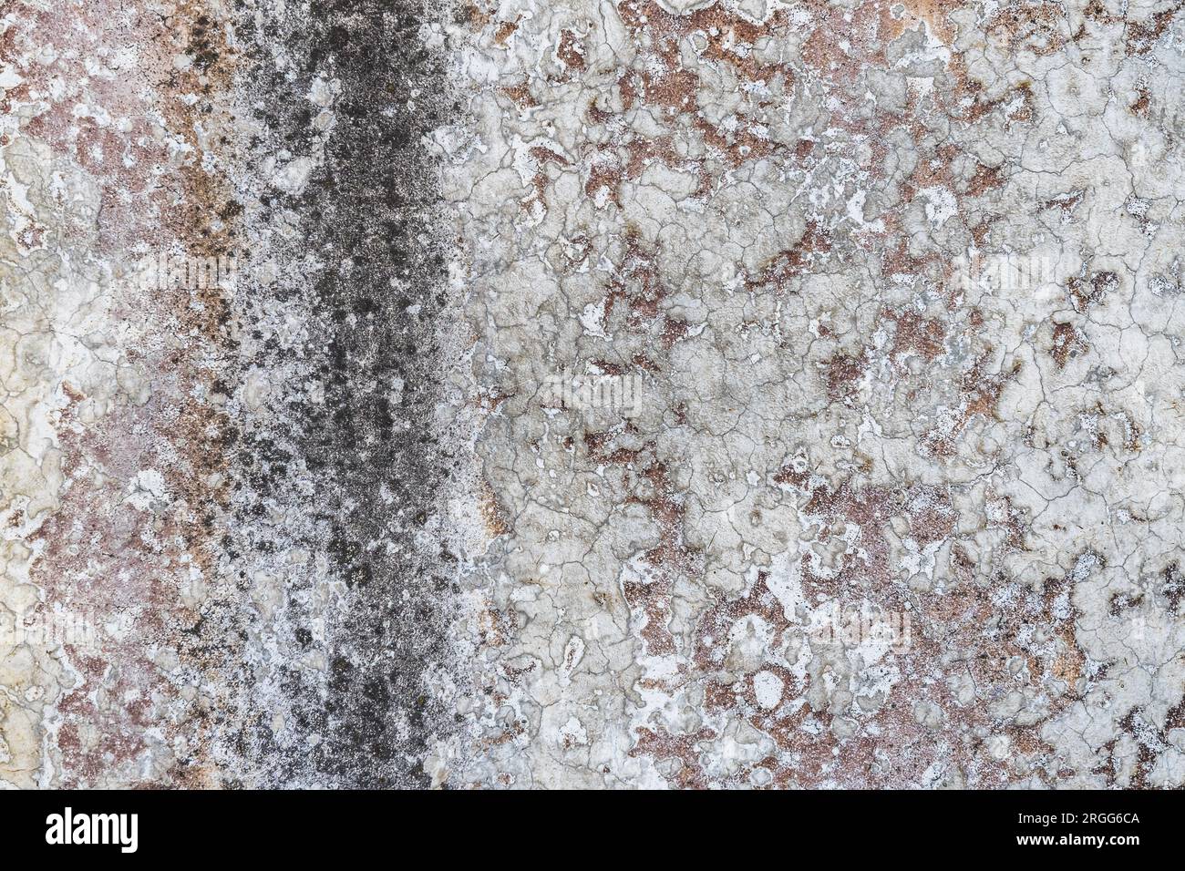 Old grungy concrete wall with old paint and lime as a background or texture Stock Photo