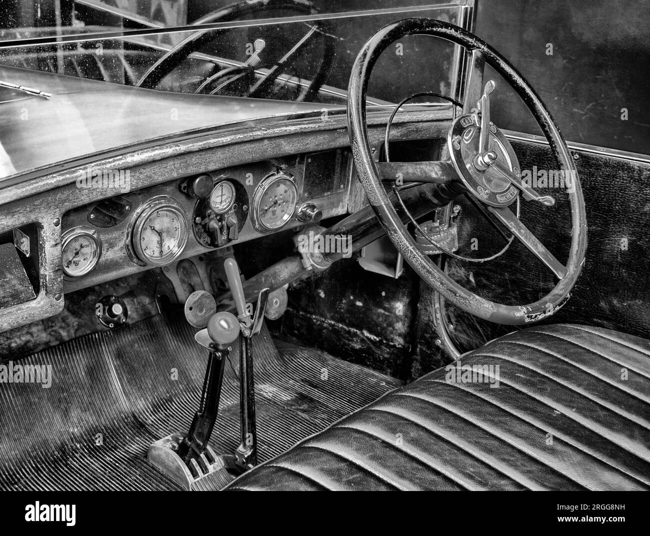 Dash board and steering wheel of Austin Twelve Clifton motor car dated 1928 at National Motor Museum, Beaulieu, New Forest, Hampshire, England, UK. Stock Photo
