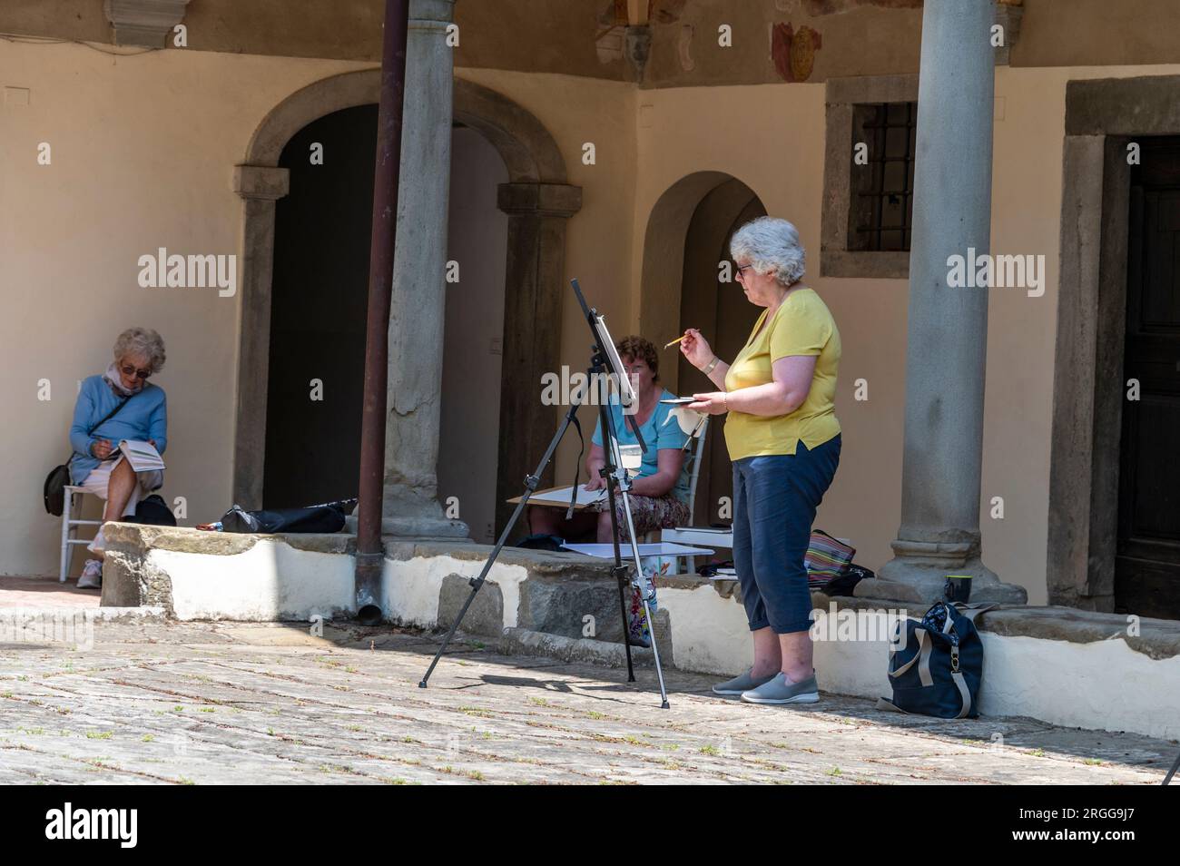 Lemmi A small group of artists at the surrounding cloisters with fading ...