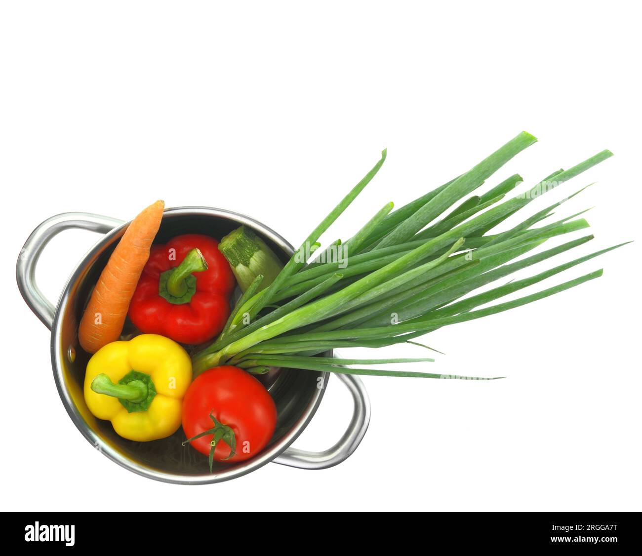 Fresh vegetables into a cooking pot isolated on white transparent background Stock Photo