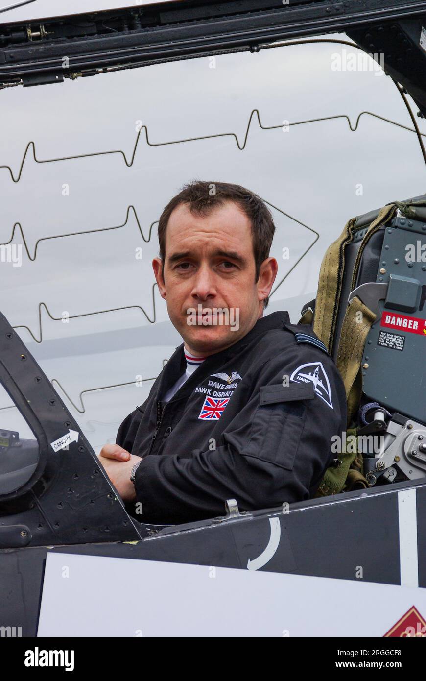 Pilot Dave Davies, Royal Air Force BAe Hawk solo display pilot in cockpit of jet plane. Canopy explosive cord for emergency ejection seat Stock Photo