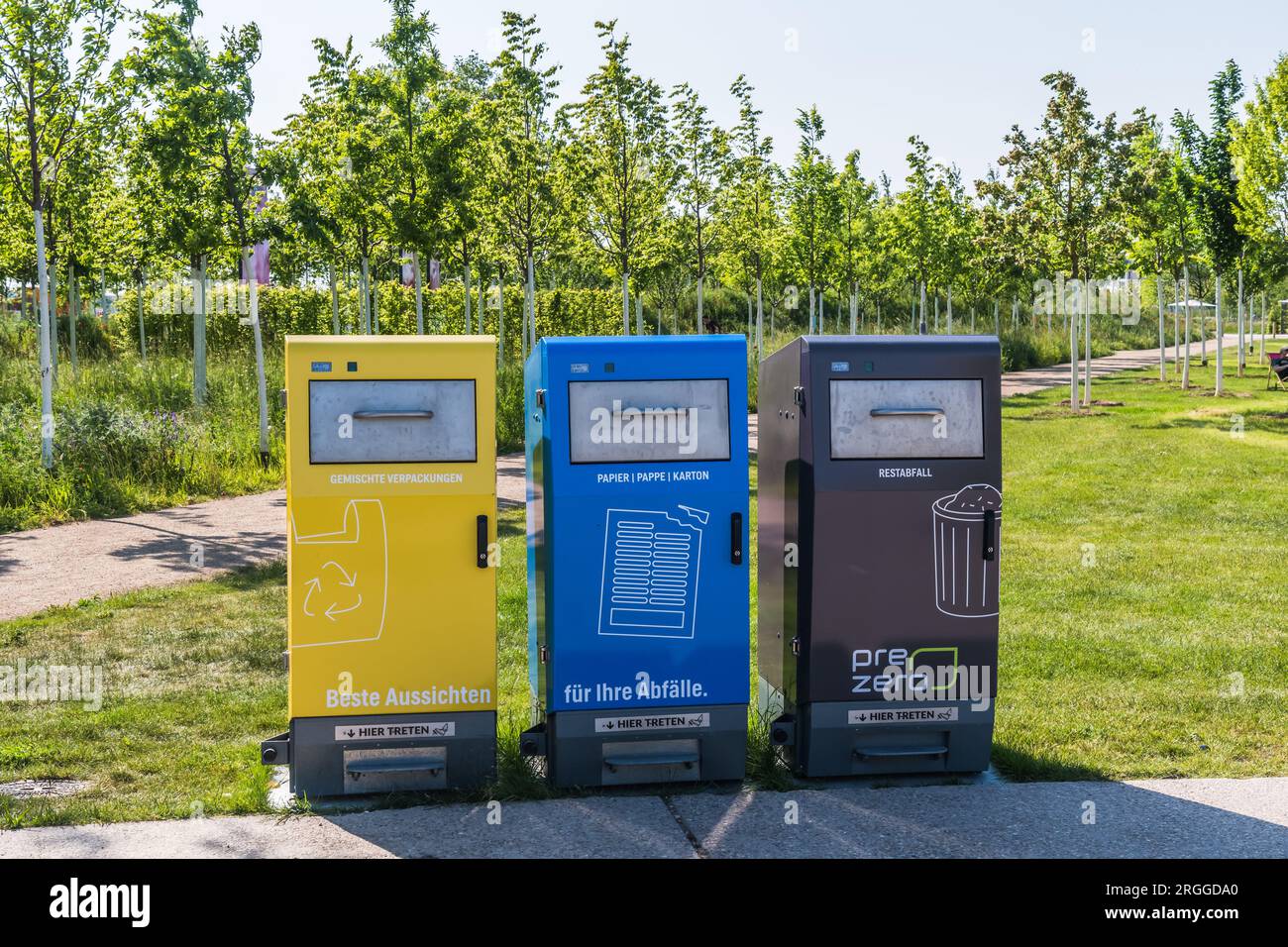 Mannheim, Germany - 26 May 2023: Waste recycling concept, sorting garbage in a public park. Text translation: for your garbage, paper and residual was Stock Photo