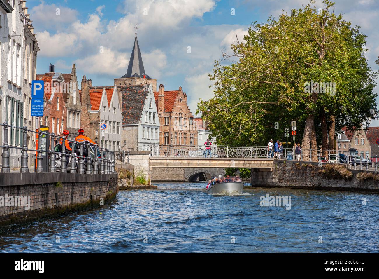 Bruges, Belgium, August 21 2014, Tourists on a sight seeing boat trip on the Brugge Zeebrugge Canal Stock Photo