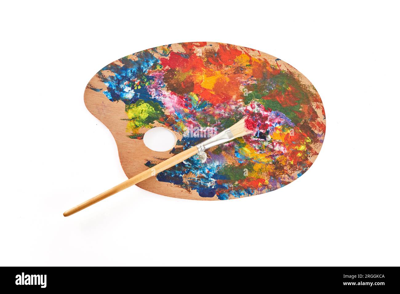 Wooden art palette with brush isolated on white background Stock Photo