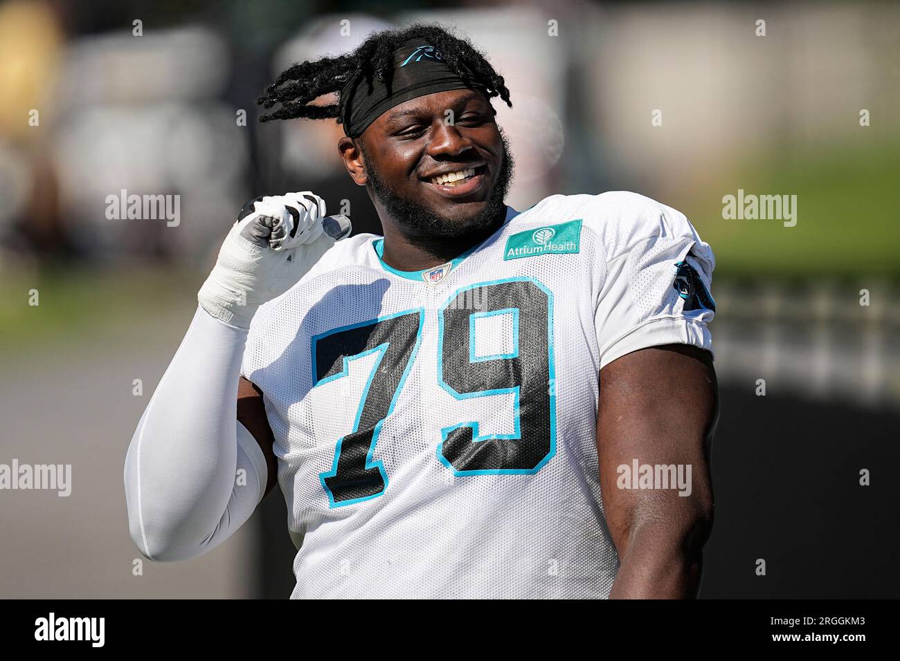 Carolina Panthers offensive tackle Ikem Ekwonu (79) arrives during a joint  NFL football camp with the