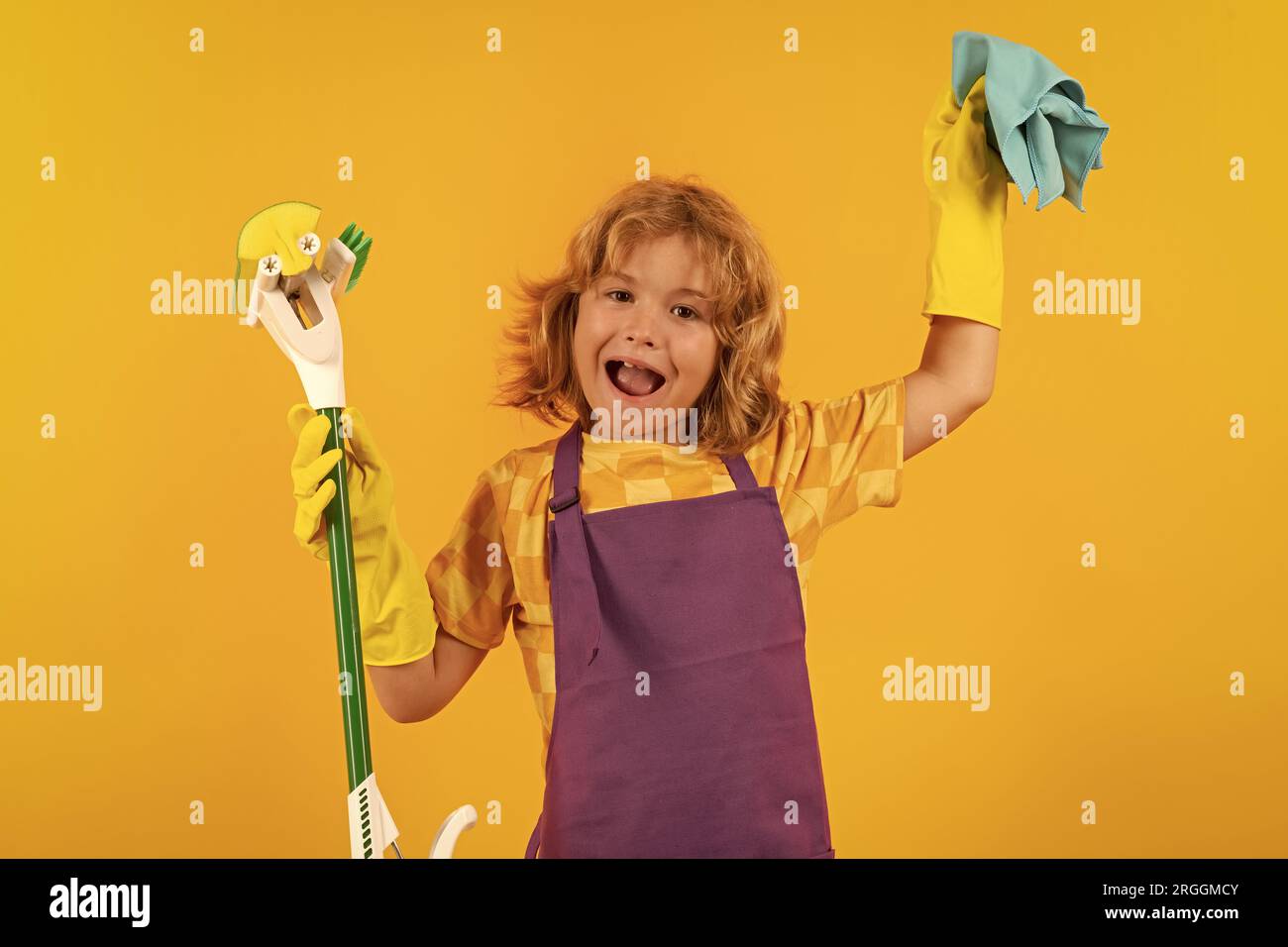 Child helping to clean. Child doing housework having fun. Studio ...