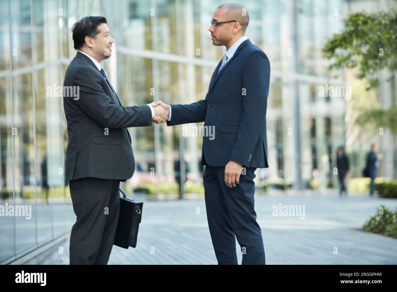 Businessmen shaking hands Stock Photo