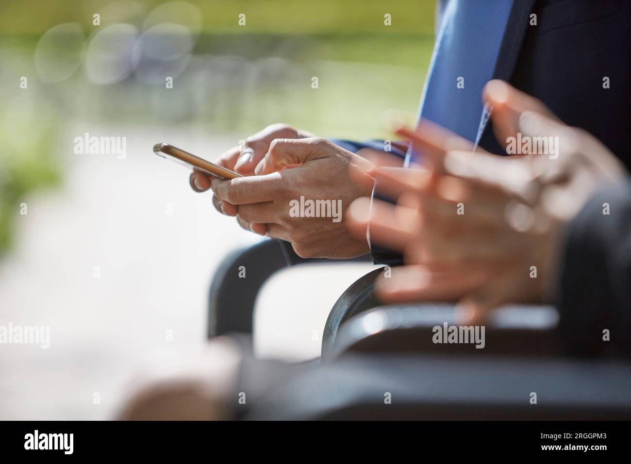 Hands of businessman using smartphone Stock Photo