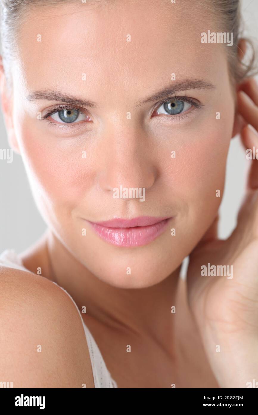 Close-up portrait of a woman with a serene expression. Stock Photo