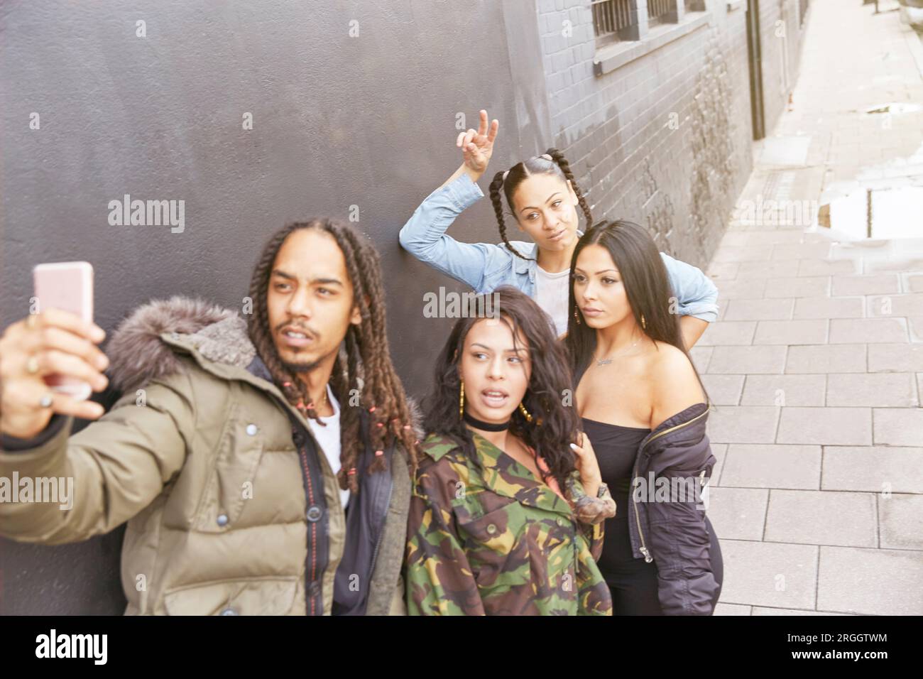 Young man taking selfie with friends Stock Photo