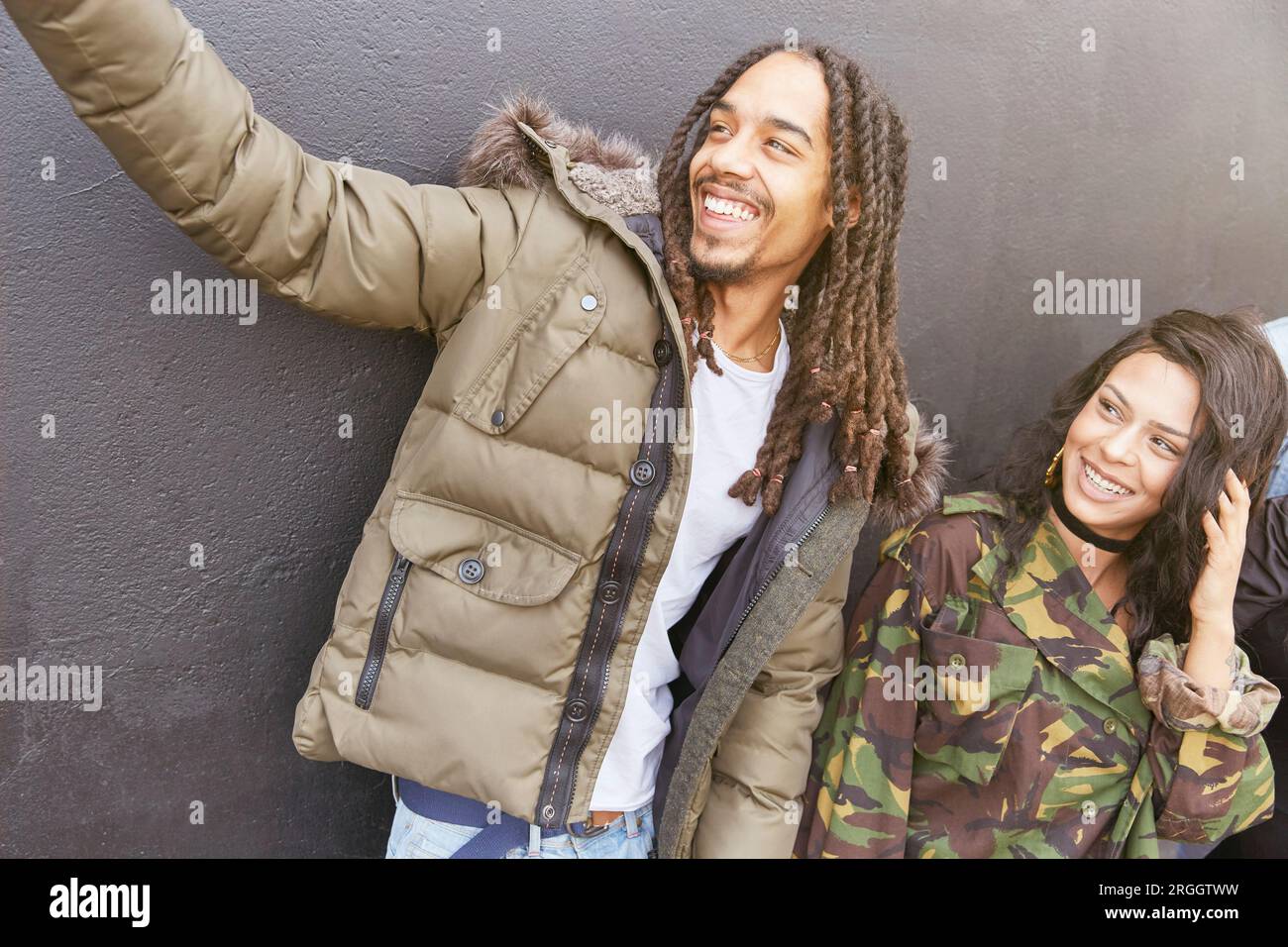 Young man taking selfie with friends Stock Photo