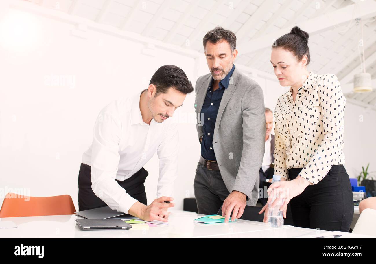 Businesspeople working together in office Stock Photo
