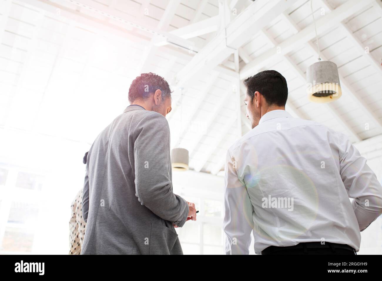 Businessmen working together in office Stock Photo