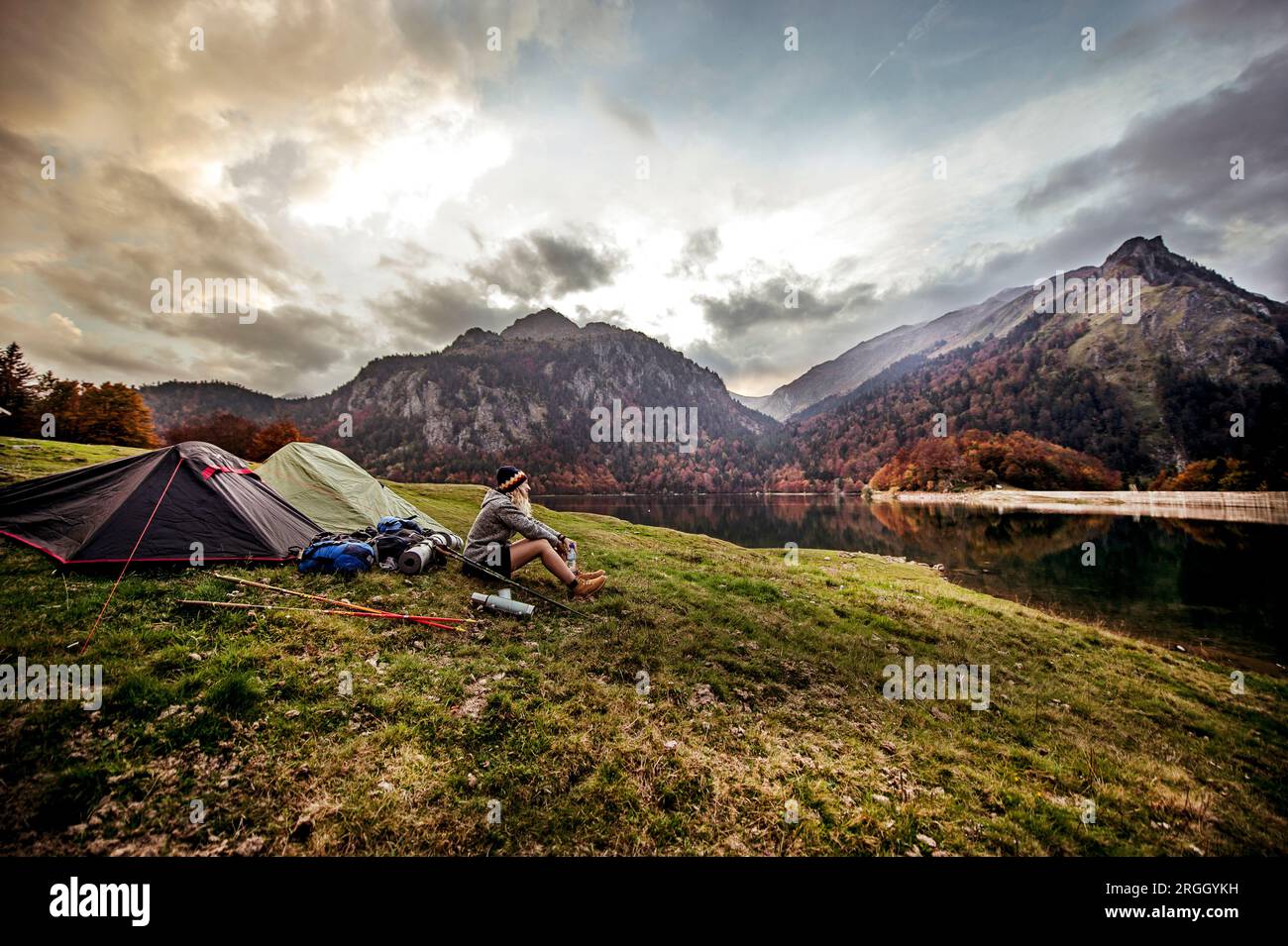 Woman resting beside lake hi-res stock photography and images - Alamy