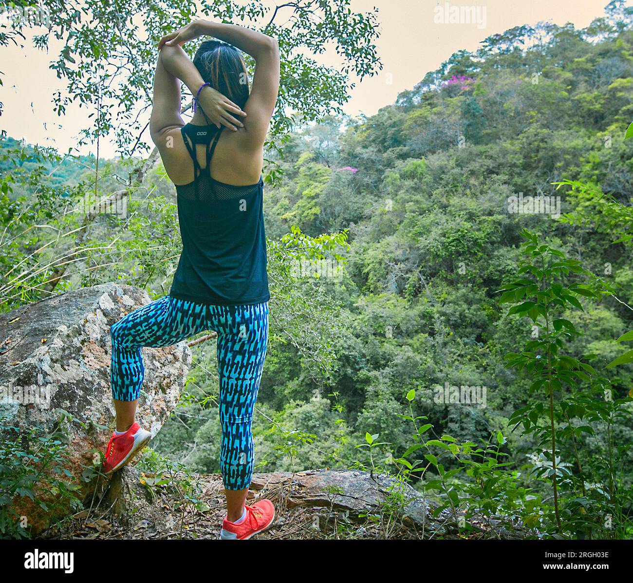 Hiker enjoying a forest view Stock Photo