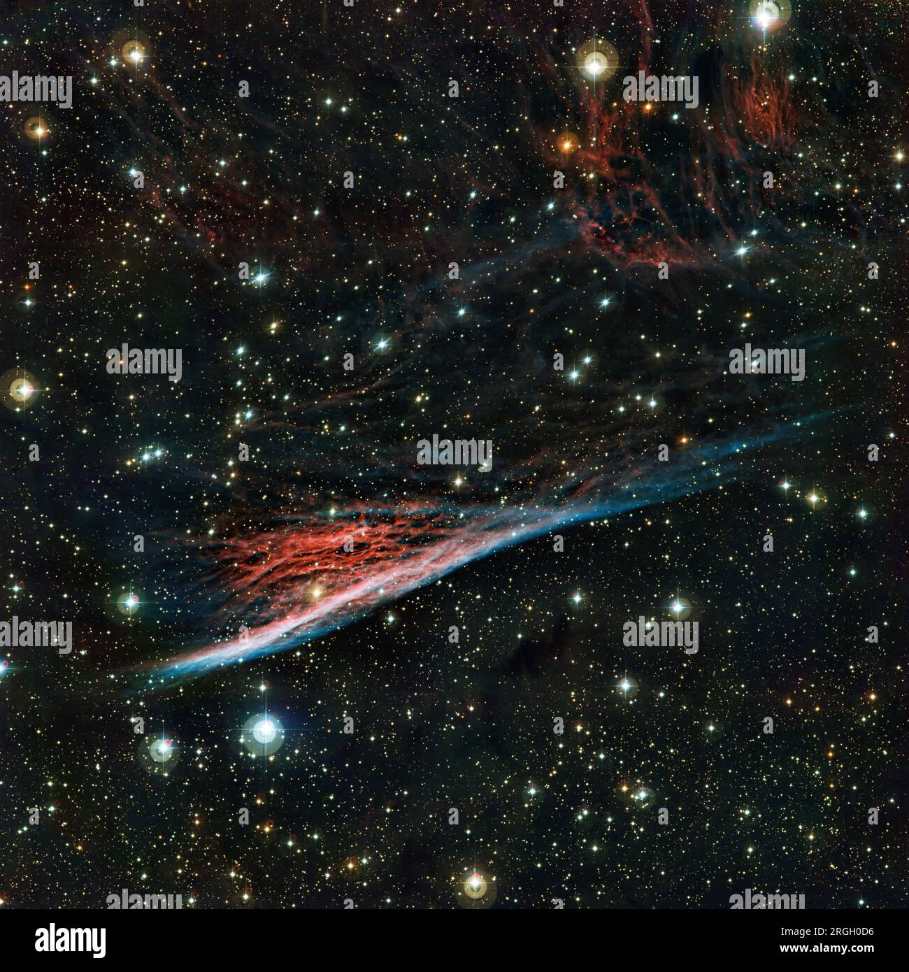 Starry night sky with vibrant nebula Stock Photo