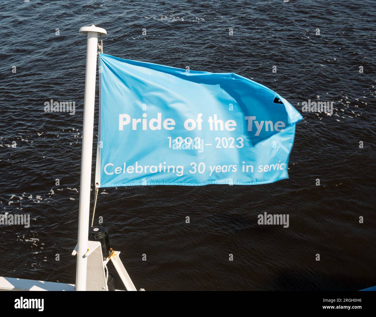 Flag flying at the stern of The Pride of the Tyne ferry, celebrating 30 years in service Stock Photo