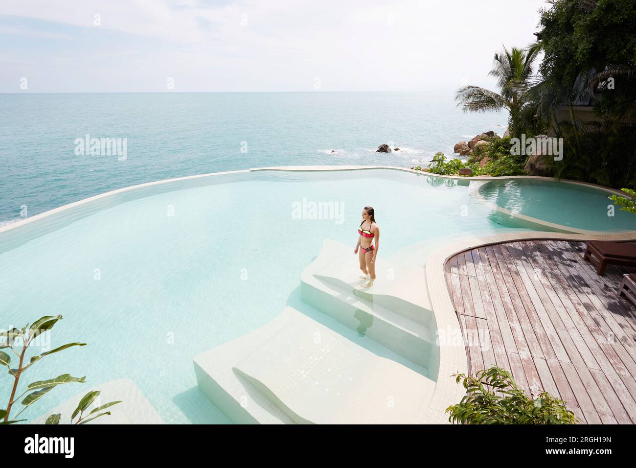 Young woman wearing bikini in swimming pool hi-res stock photography ...