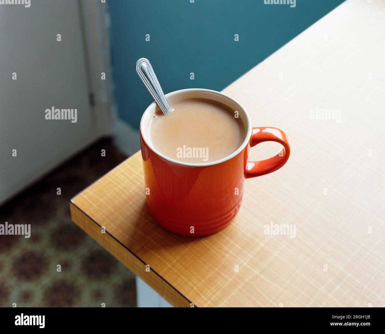 Red tea mug with spoon Stock Photo