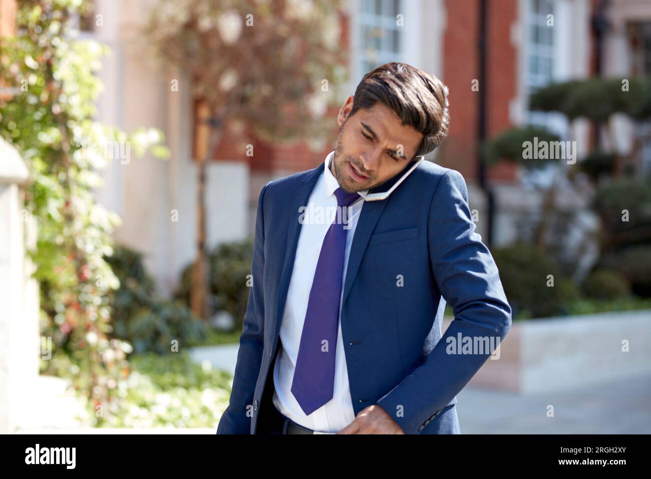 Businessman talking on smart phone Stock Photo