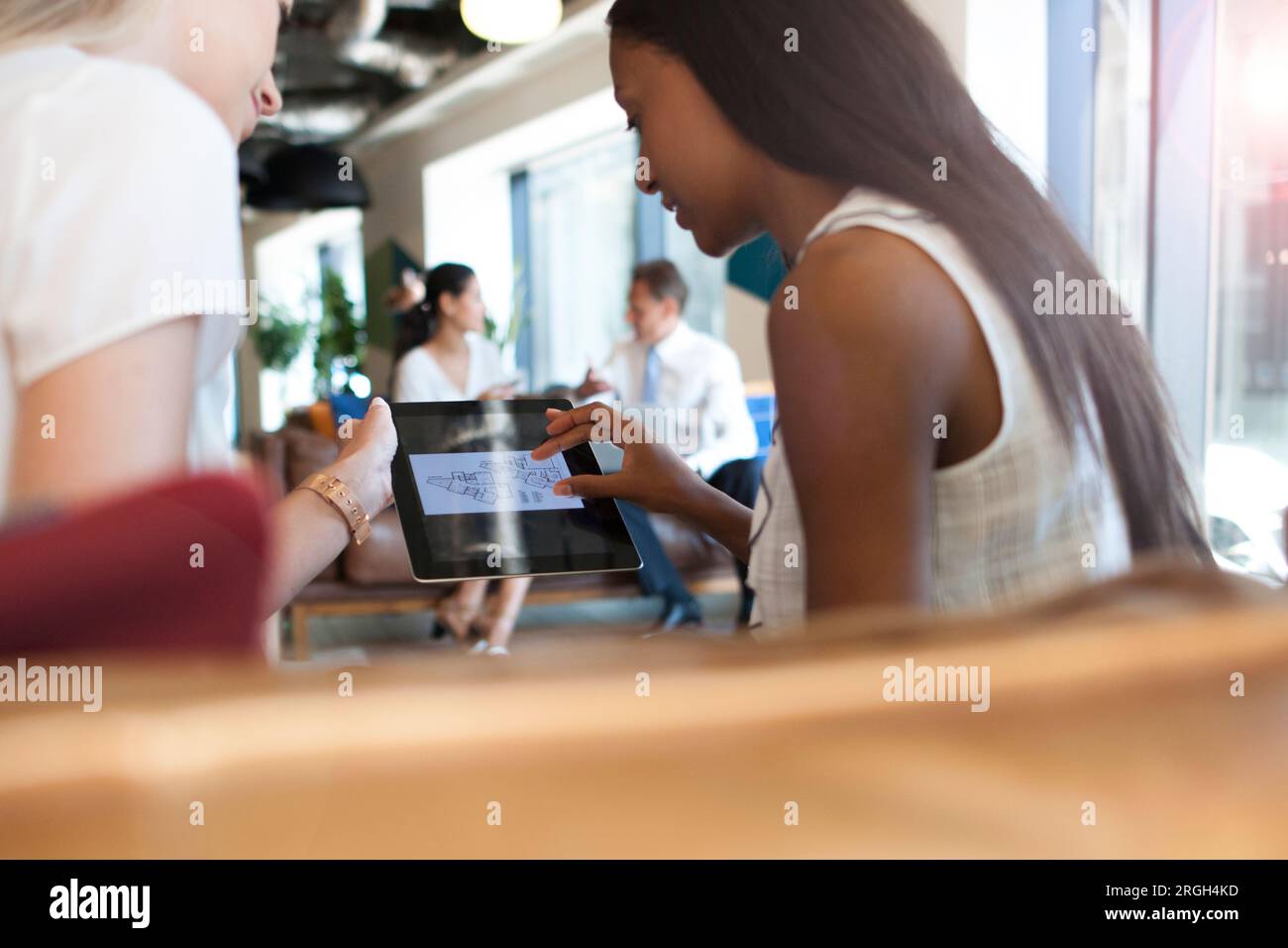Businesswomen using digital tablet Stock Photo