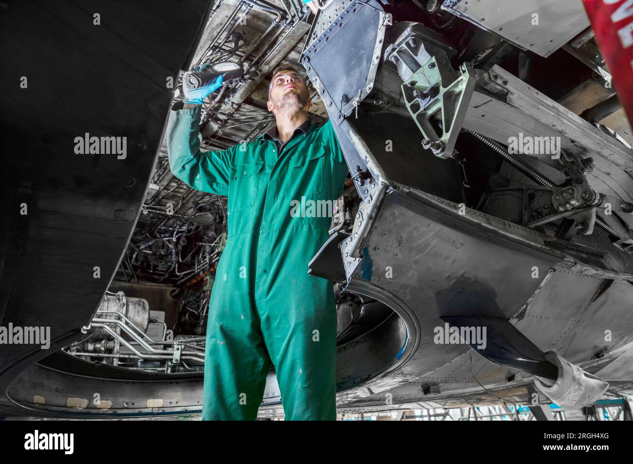 Man working on airplane Stock Photo