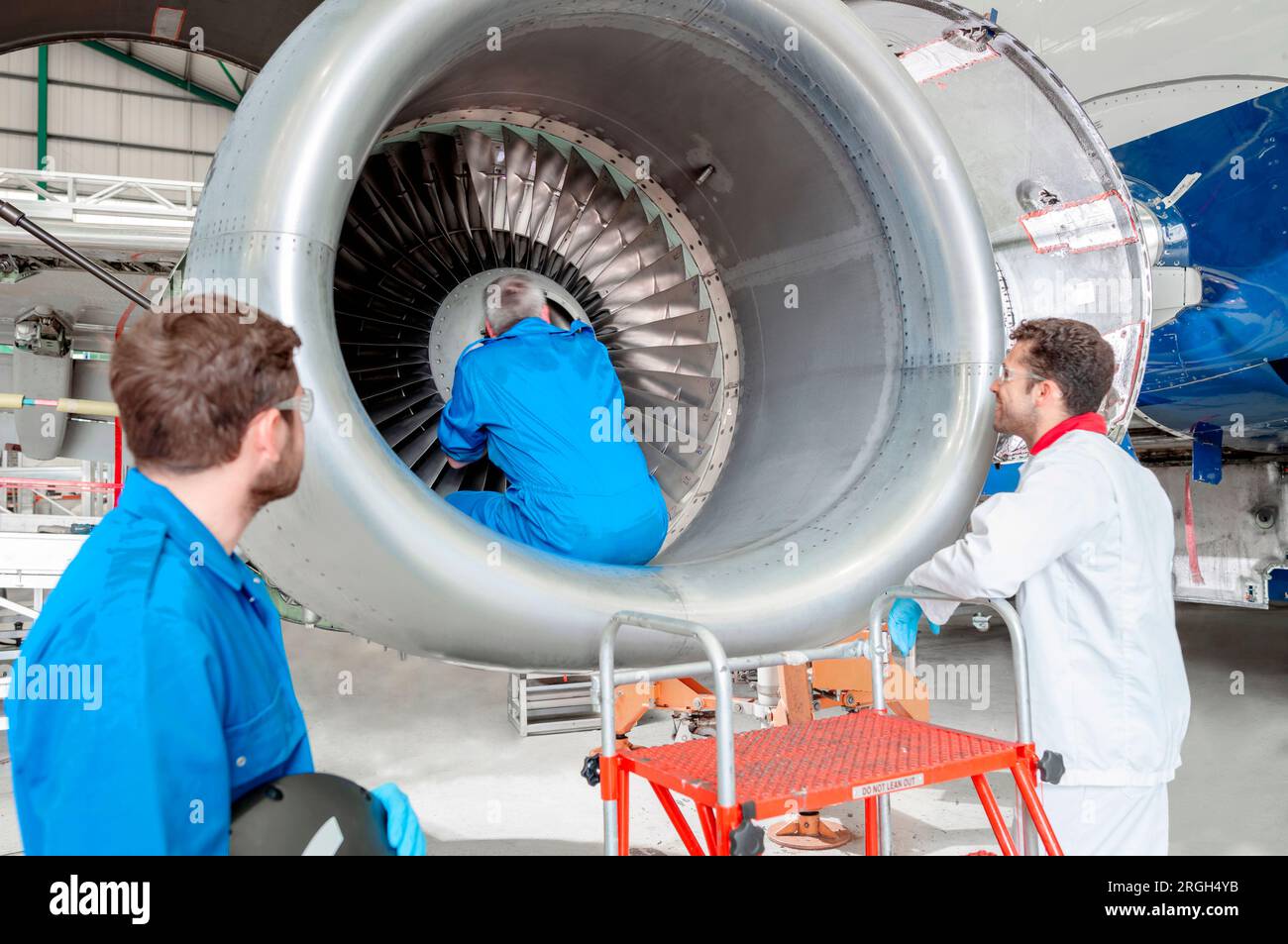 Men working on airplane engine Stock Photo Alamy