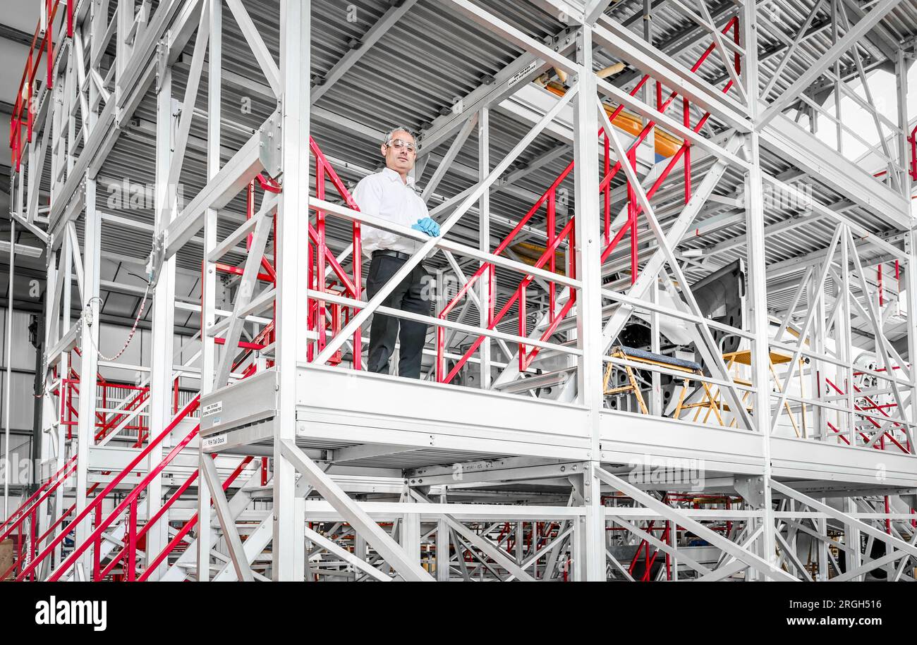 Man wearing safety equipment on staircase Stock Photo Alamy