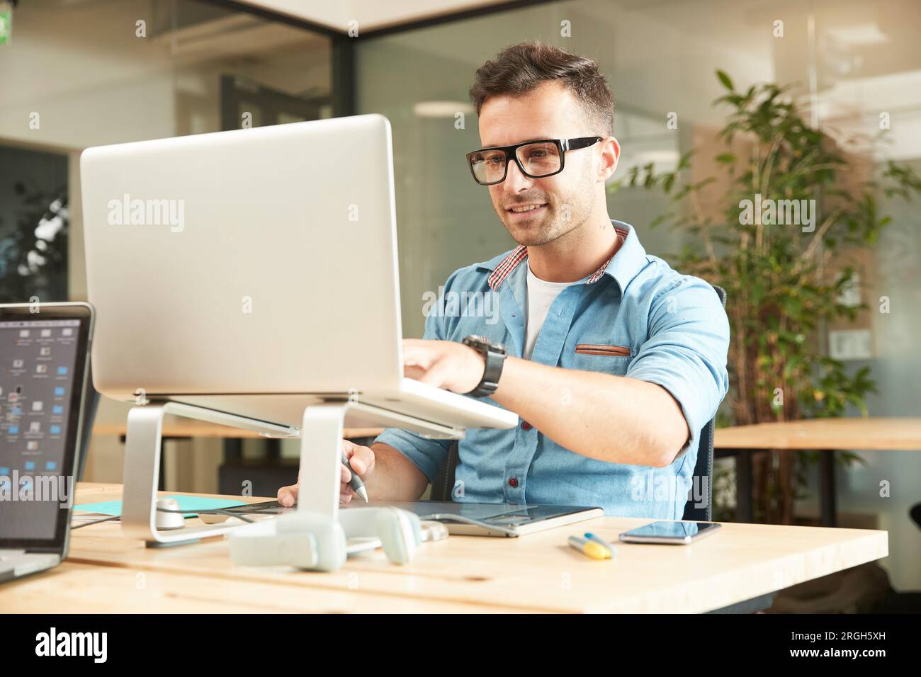 Young man working on laptop Stock Photo