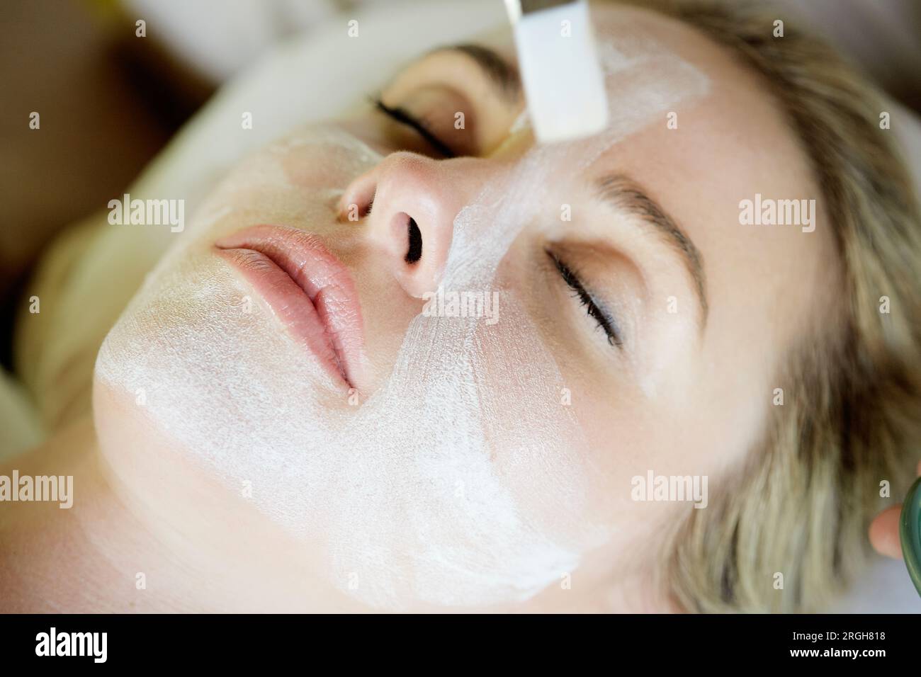 Blond woman mask face lying hi-res stock photography and images - Alamy