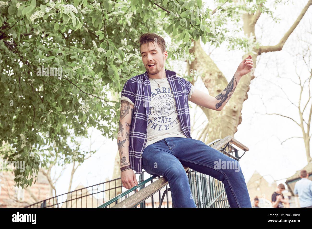 Teenage boy sliding on railing Stock Photo Alamy