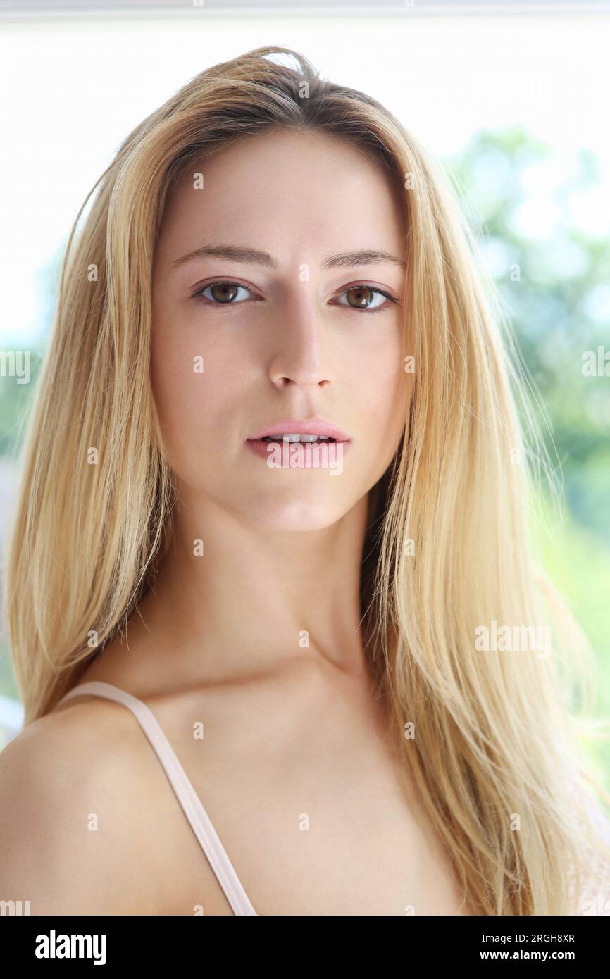 Portrait of a blonde woman with a neutral expression. Stock Photo
