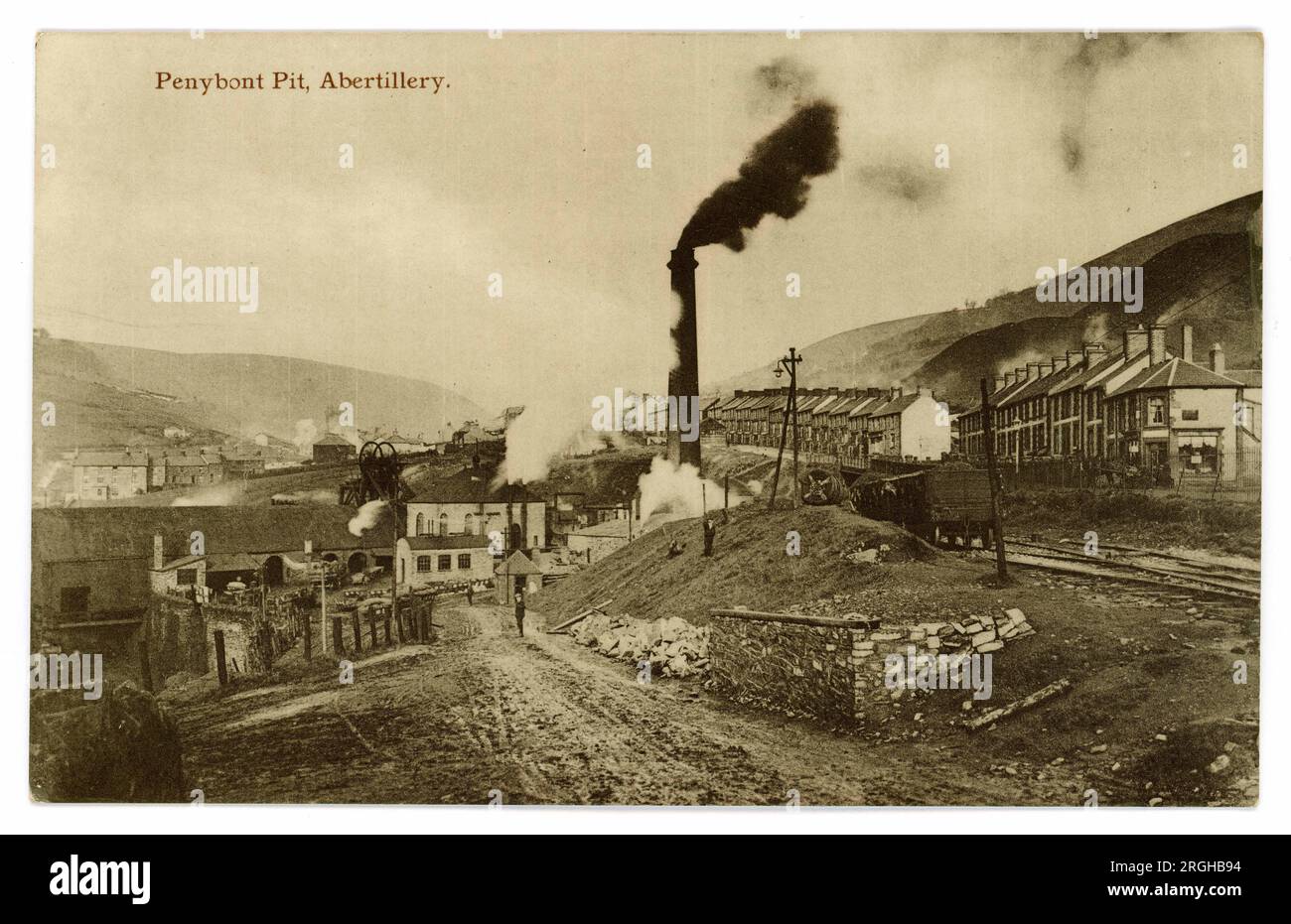 Original early 1900's postcard of industrial Welsh mining landscape,  showing smoking chimneys at Penybont Pit, Abertillery, Monmouth, South Wales, U.K. circa 1910. Stock Photo